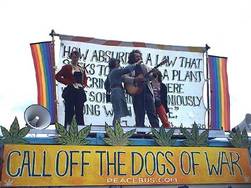 Protest organiser Sam Leonard  watching Paul Joseph and Lisa Yeates sing, "Lets all get stoned and get naked and lie in a great big pile"